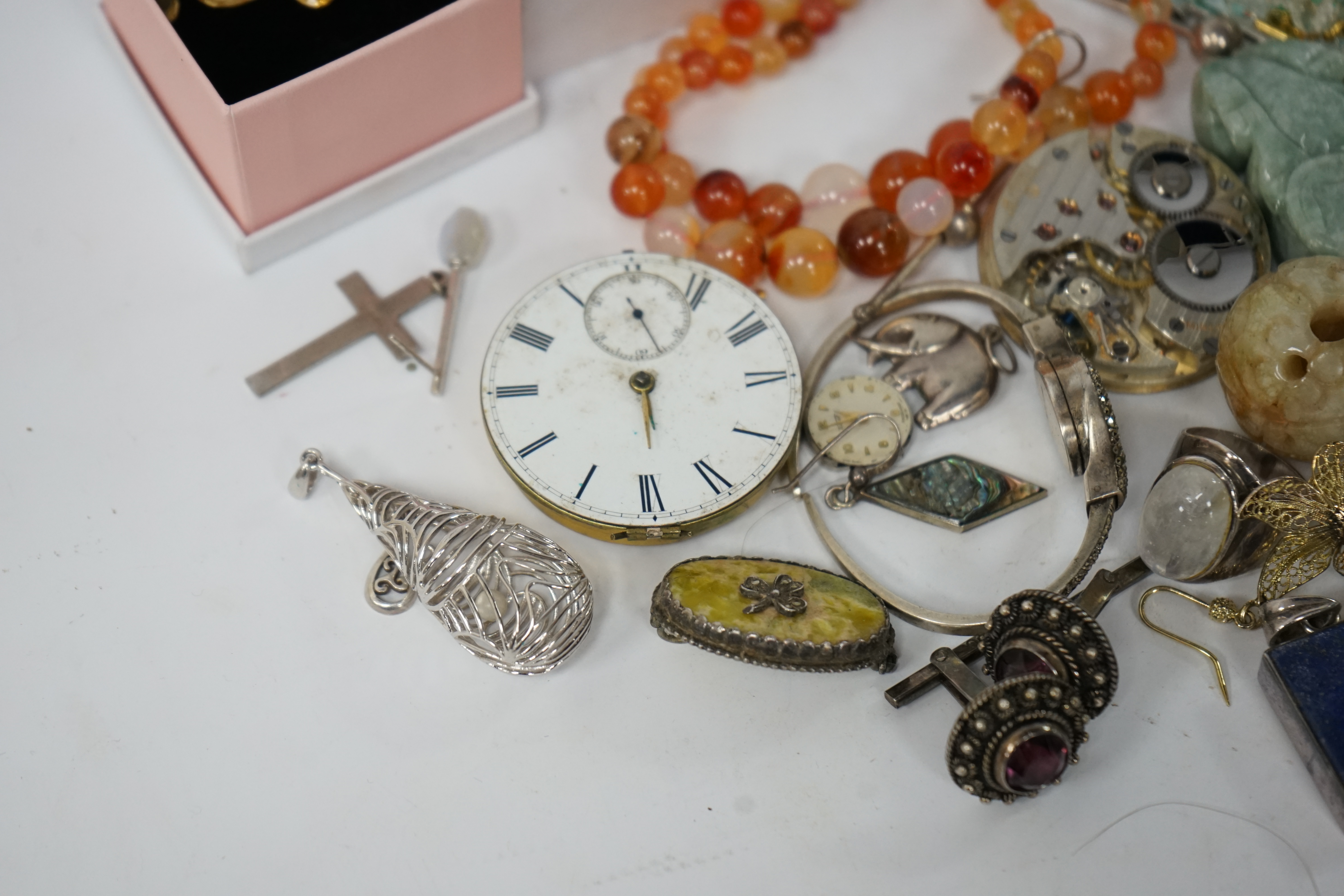 A small quantity of assorted jewellery and other items including a filigree butterfly brooch, a 925 and labradorite ring, an agate bead necklace, pocket watch movements, etc. Condition - poor to fair